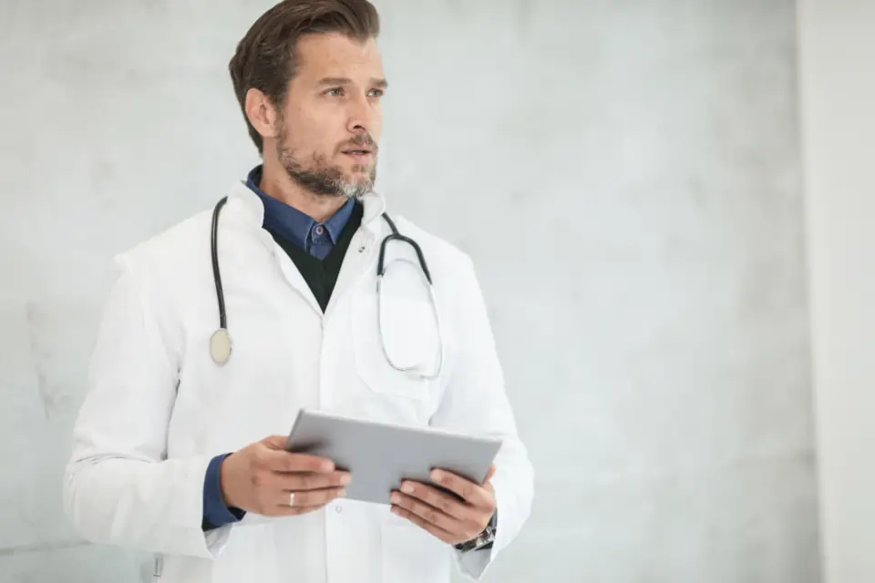 Doctor holding a tablet (stock photo)